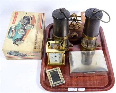 Lot 191 - Two mining lamps, postal scales, brass carriage timepiece, plated cigarette box, 1932 Chevrolet...