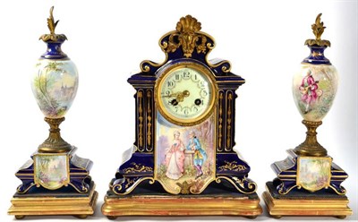 Lot 210 - A French porcelain clock garniture, gilt mounts