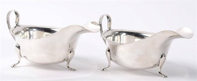 Lot 217 - A matched pair of silver sauce boats, Viners Ltd, Sheffield 1937/45; and a late Victorian...