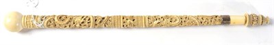 Lot 227 - A Chinese carved ivory parasol handle, late 19th century, dragon, bird and butterfly design,...