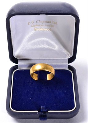 Lot 245 - A 22 carat gold band ring, finger size L1/2, 4.8g