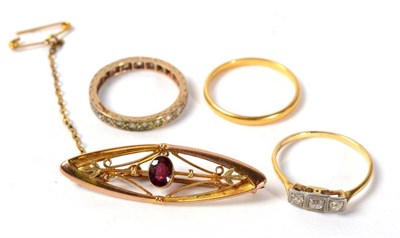 Lot 251 - A 22 carat gold band ring, 2.3g; a diamond three stone ring; a paste eternity ring; and a...