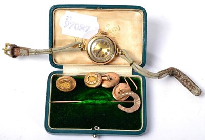 Lot 265 - A 9 carat gold lady's wristwatch; a pair of cufflinks and a stickpin (3)