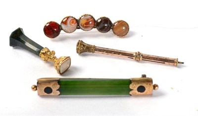 Lot 276 - A hardstone desk seal, a propelling pencil, a nephrite brooch and a Scottish hardstone brooch