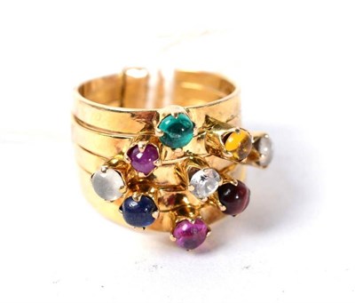 Lot 278 - A multi gemstone stacking ring, of five bands each set with a cabochon, including emerald, citrine