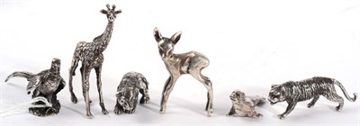 Lot 294 - A group of miniature white metal models of animals, comprising: a polar bear; a tiger; a seal;...