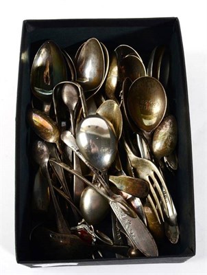 Lot 297 - A quantity of assorted silver spoons, forks; tongs etc, including souvenir examples; caddy...