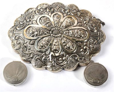 Lot 300 - An Ottoman white metal mirror, embossed back; together with two Saville compacts (3)