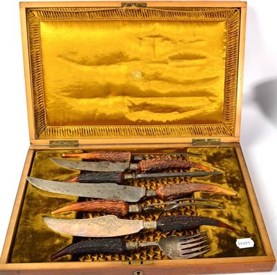 Lot 310 - An oak cased seven piece antler handled and silver collared carving set