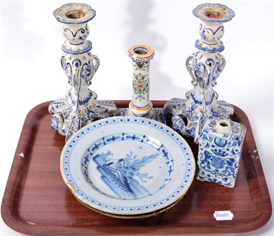 Lot 311 - A pair of Delft candlesticks; a Delft caddy painted with an armorial; two Delft plates and a...