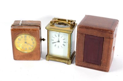 Lot 344 - A Cosmos Brevette electric travel clock; and a carriage clock