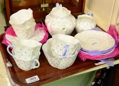 Lot 369 - A Shelley harlequin spotted teaset, comprising six cups, six saucers, cream jug, teapot and...