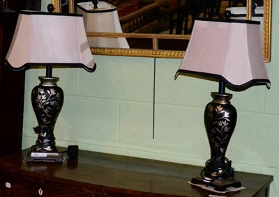 Lot 382 - A pair of Toleware style table lamps