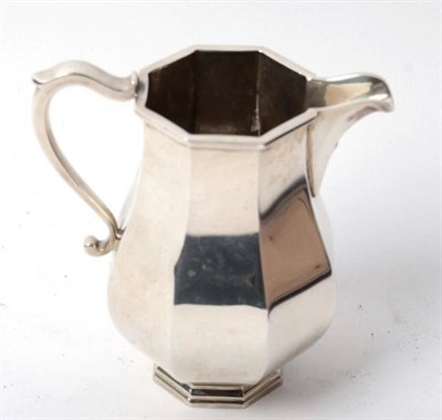 Lot 391 - An octagonal baluster silver cream jug, C J Vander, London 1975, 9.5ozt