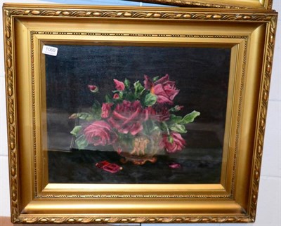 Lot 1069 - J C Milbourne (20th century), Roses in a vase decorated with putti, signed oil on canvas