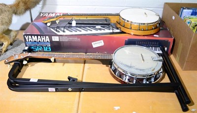 Lot 1128 - Two banjos; and a Yamaha PSR-18 keyboard and stand