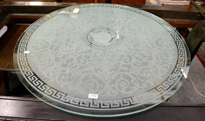 Lot 1202 - A frosted glass circular table top with etched decoration; a carved oak mantle shelf and a...