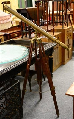 Lot 1211 - A reproduction brass telescope on stand