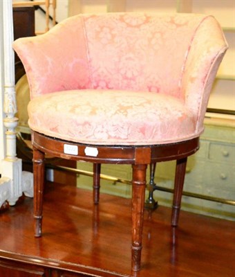 Lot 1222 - A small French walnut and upholstered revolving chair