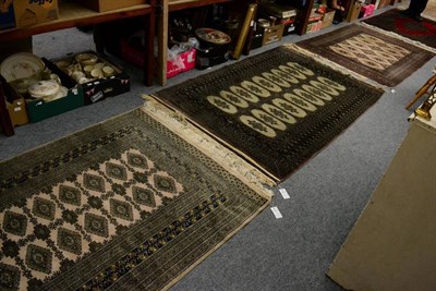 Lot 1243 - Three Bokhara style rugs; together with two Chinese style carved rugs (5)