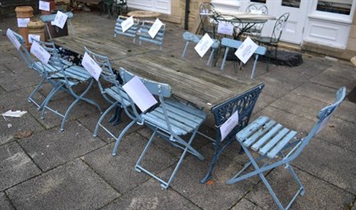 Lot 1246 - A pair of wooden slatted garden tables with blue painted cast iron supports, together with two sets