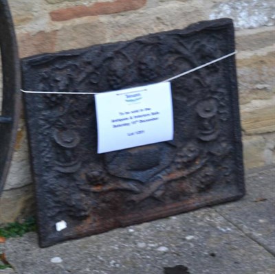 Lot 1251 - A cast iron back decorated with a coat of arms