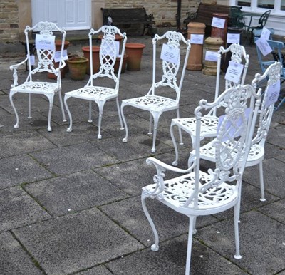 Lot 1256 - A set of six white painted garden chairs