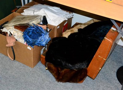 Lot 1258 - Suitcase of fur capes, throws, stoles, muffs; together with black fur long coat