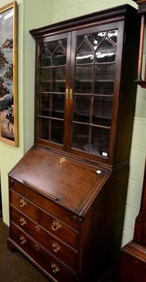 Lot 1276 - A Georgian Gothic oak bureau bookcase, circa 1750