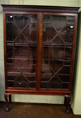 Lot 1277 - A 19th century mahogany astragal glazed bookcase on stand