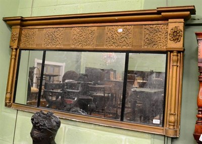 Lot 1279 - A sectional inverted breakfront over mantle mirror