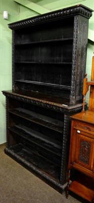 Lot 1286 - A late Victorian carved oak open shelf bookcase