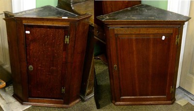 Lot 1292 - Two George III oak corner cupboards