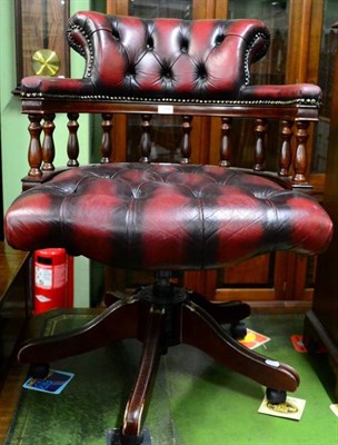 Lot 1298 - A leather captain's chair