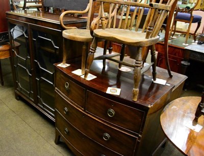 Lot 1303 - A George III mahogany three height chest of drawers and an astragal glazed mahogany bookcase