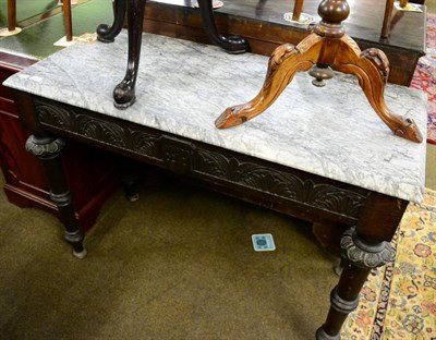 Lot 1311 - A Victorian carved oak console table with a veined grey marble top