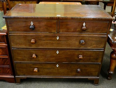 Lot 1317 - An early 19th century mahogany four height chest of drawers