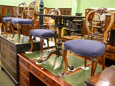 Lot 1319 - A set of four Victorian carved walnut balloon back dining chairs, circa 1870, recovered in blue...