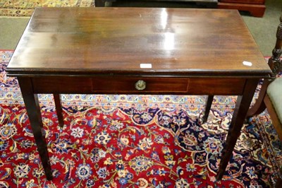 Lot 1322 - A George III mahogany foldover tea table