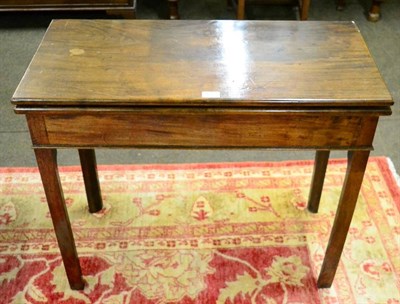 Lot 1325 - George III mahogany fold over tea table