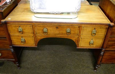 Lot 1328 - A Regency mahogany and crossbanded kneehole sideboard, the central drawer flanked by two...