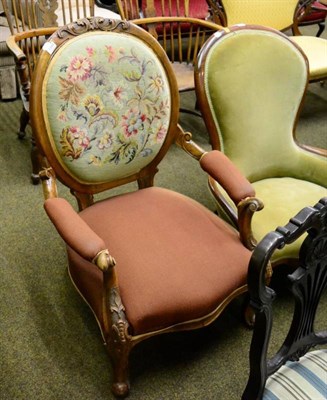 Lot 1349 - Victorian walnut framed open armchair with needlework padded back support