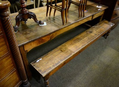 Lot 1375 - A 19th century Provincial oak refectory table, together with two benches (old worm)