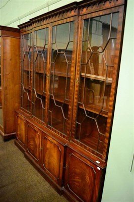 Lot 1386 - A George III style glazed breakfront bookcase