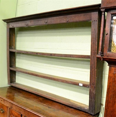 Lot 1397 - An 18th century oak wall rack