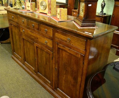 Lot 1406 - A large 20th century sideboard comprising six drawers above four cupboard doors