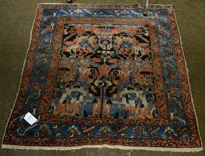 Lot 1423 - Hamadan rug, Iranian Kurdistan, the indigo field of stylised flowers enclosed by triple...