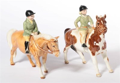 Lot 141 - Beswick Girl on Pony, model No. 1499, Skewbald gloss and Boy on Pony, model No. 1500, Palomino...