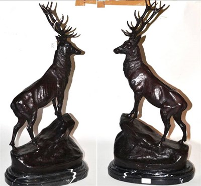 Lot 200 - After Jules Moigniez: a pair of bronze figures of stags, on rocky mound bases, signed J...