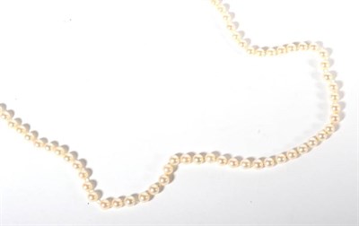 Lot 209 - A single strand cultured pearl necklace, with a pearl set clasp, length 85cm, pearls measure...